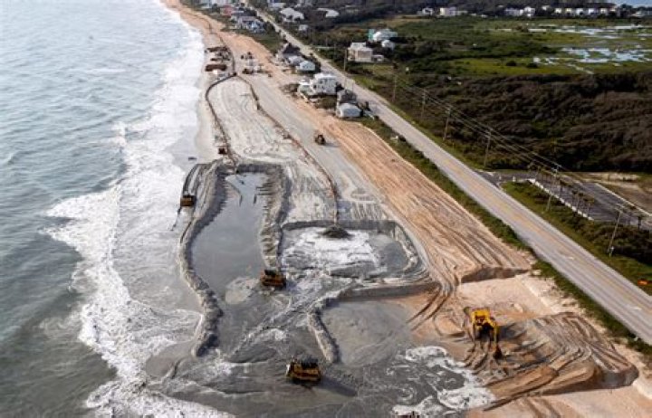 How is beach renourishment done?